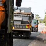 A road maintenance crew in action on a local road resurfacing project.