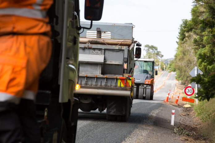 A road maintenance crew in action on a local road resurfacing project.