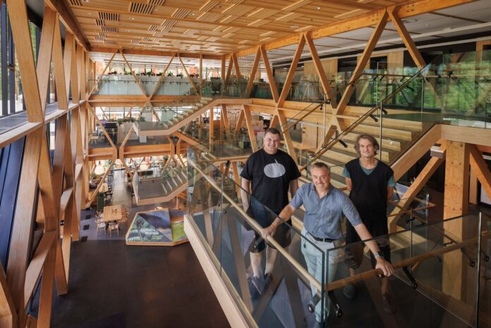 From left: BIG partner Kai-Uwe Bergmann, Scion Forests to Timber Products general manager Dr Henri Bailleres, and architect Jeremy Smith inside Scion’s award-winning building Te Whare Nui o Tuteata in Rotorua.